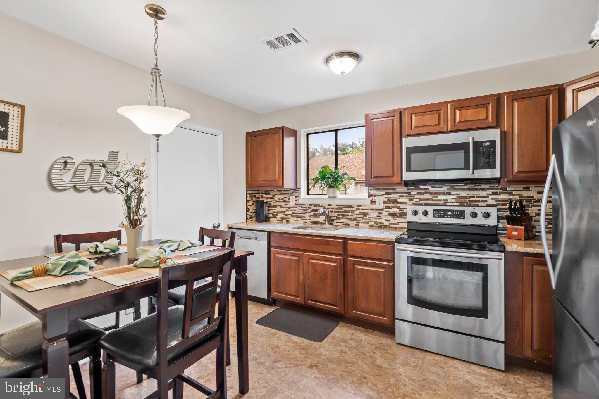 1475 Mt Holly Road, Unit F2 Edgewater Park, NJ 08010 - Photo 12 of 33 Modern kitchen with warm wood tones.