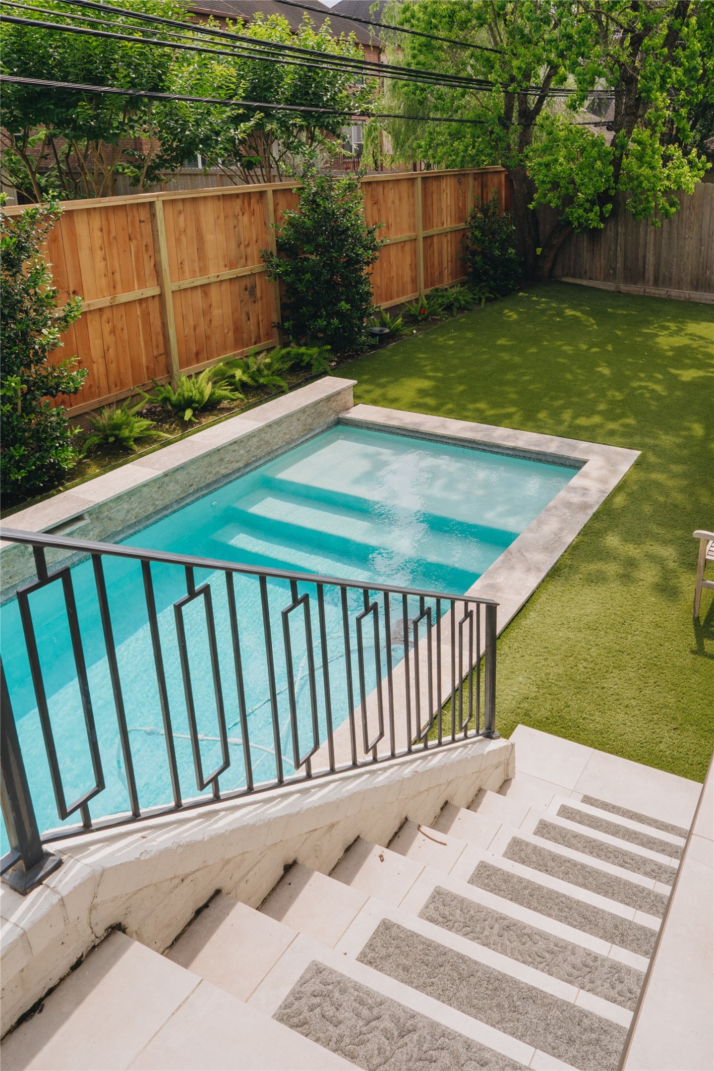 3817 Aberdeen Way Houston, TX 77025 - Photo 43 of 45 Walk down the patio stairs to your beautiful back yard with heated pool!