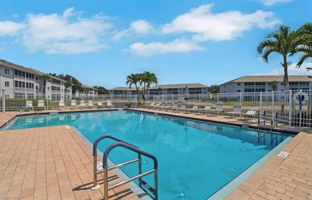 a view of a swimming pool with a terrace