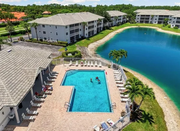an aerial view of a house with a swimming pool