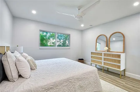 a bedroom with bed and a window