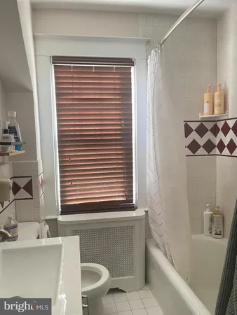 a bathroom with a bathtub and a sink