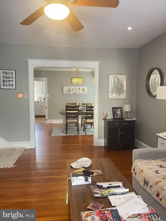 a living room with couch and wooden floor