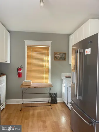 a living room with a table and a window
