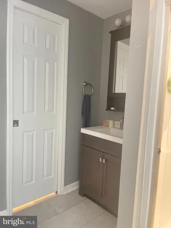 a bathroom with a sink and mirror