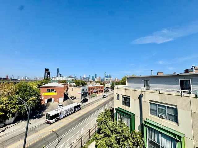 a view of a house with a deck front of house