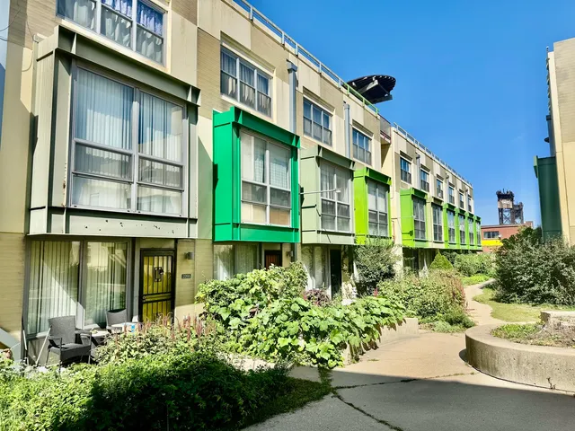 a view of a house with backyard sitting area and swimming pool