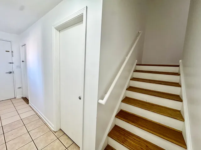 a view of entryway with wooden floor