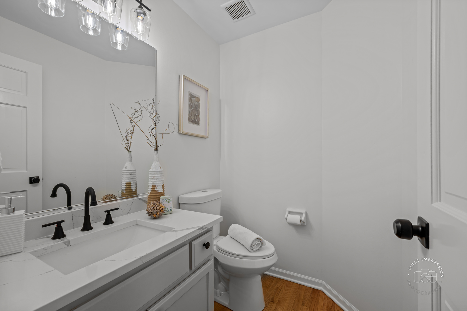 225 North Canterbury Road Aurora, IL 60506 - Photo 18 of 42 a bathroom with a sink vanity mirror and toilet