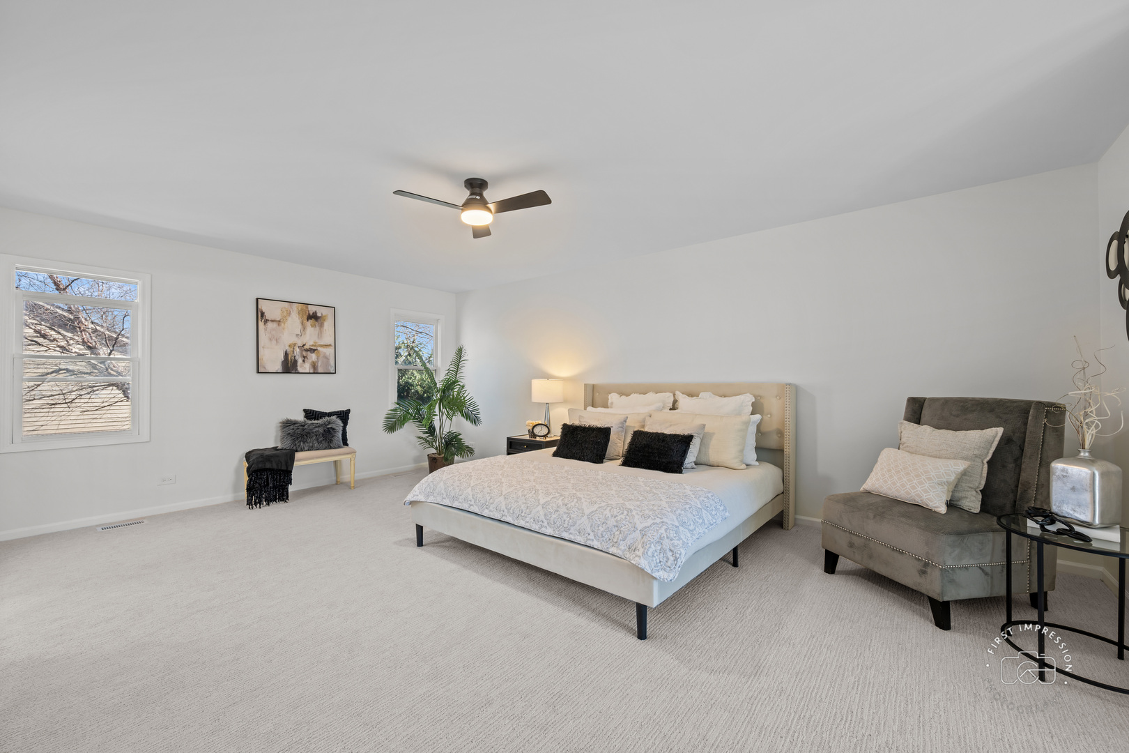 225 North Canterbury Road Aurora, IL 60506 - Photo 19 of 42 a bedroom with a bed couch and painting on the wall