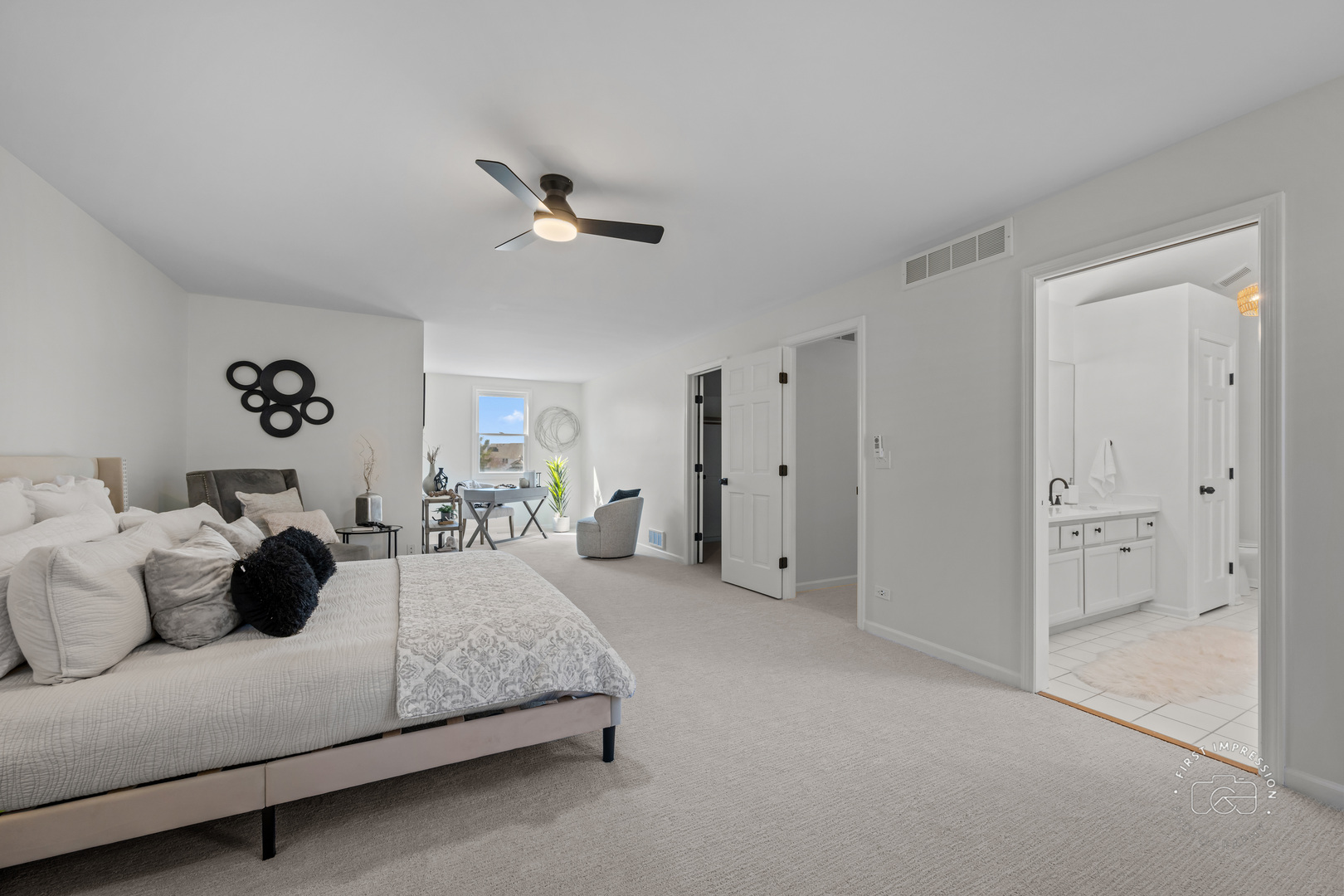 225 North Canterbury Road Aurora, IL 60506 - Photo 21 of 42 a spacious bedroom with a bed and ceiling fan