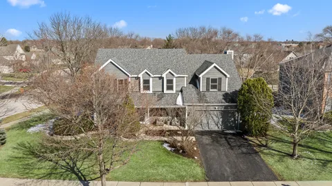 a view of multiple houses with a yard