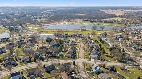 an aerial view of residential building and lake
