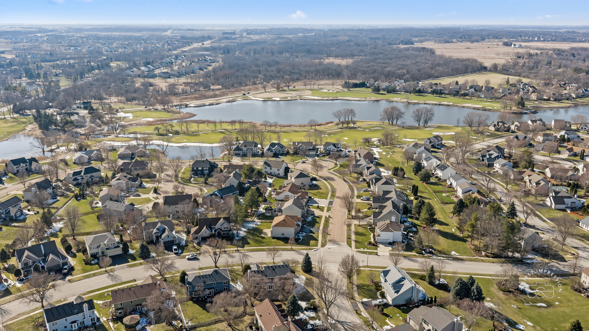 225 North Canterbury Road Aurora, IL 60506 - Photo 36 of 42 an aerial view of residential building and lake