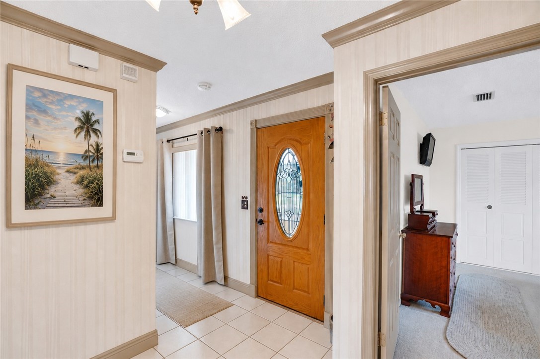 7666 134th Street Sebastian, FL 32958 - Photo 7 of 35 a view of a hallway with windows and closet