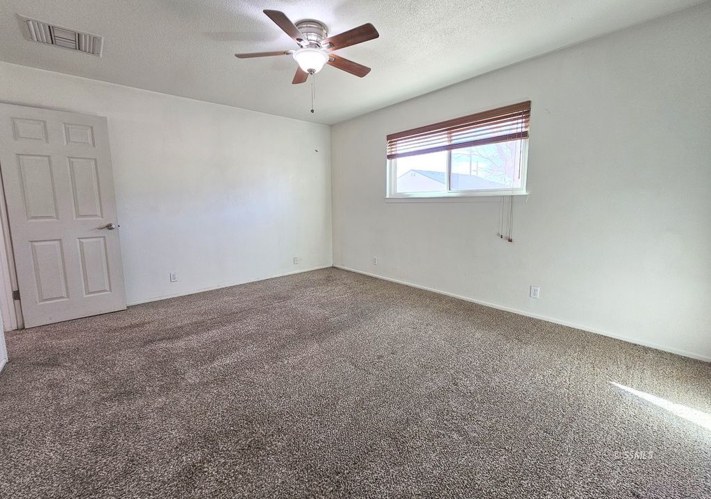 341 South Fountain Street Ridgecrest, CA 93555 - Photo 20 of 25 a view of a livingroom with a ceiling fan and window