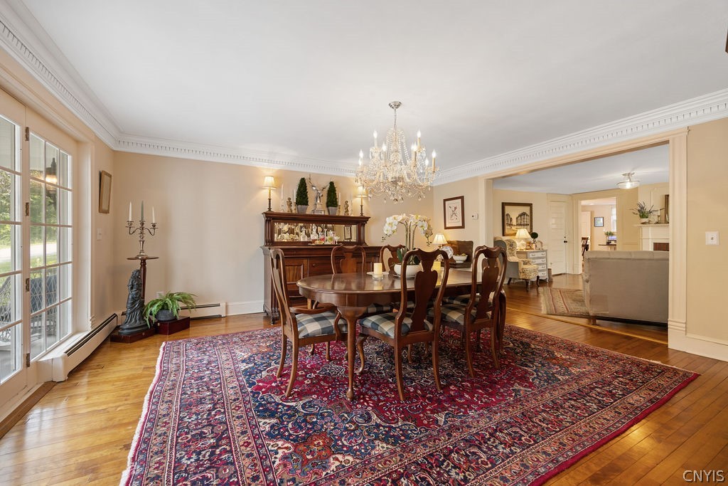 7942 Salt Springs Road Manlius, NY 13104 - Photo 12 of 50 The spacious dining room features a front wall of floor to ceiling windows with a glass center door that allows your entertainment to flor to the amazing front porch