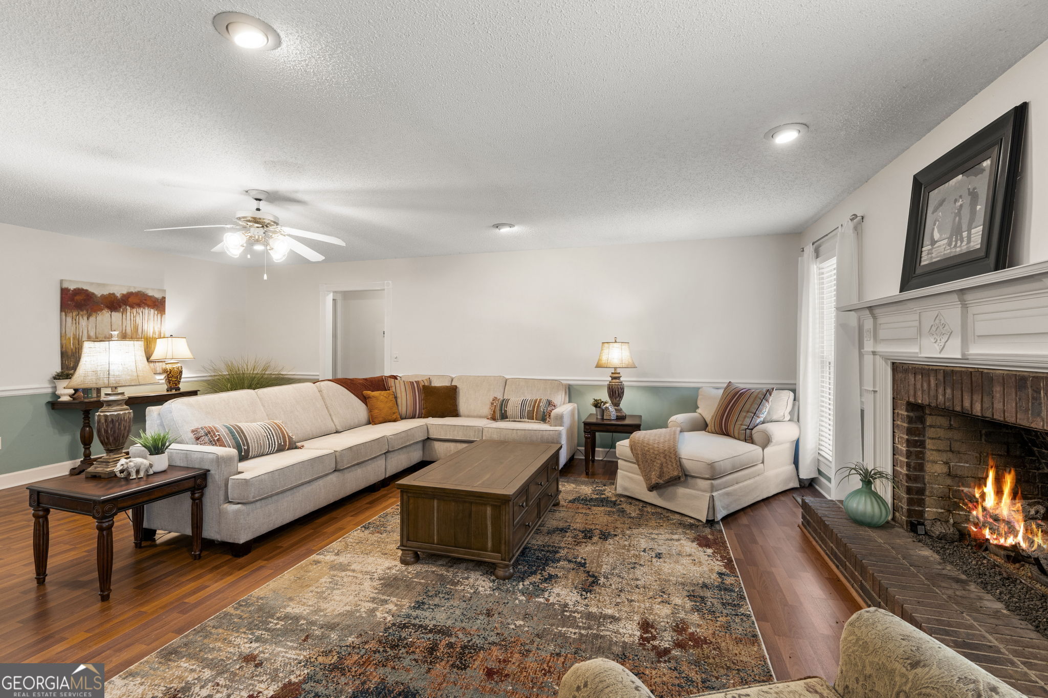 119 Moll Drive Cochran, GA 31014 - Photo 11 of 66 a living room with furniture fireplace and a lamp
