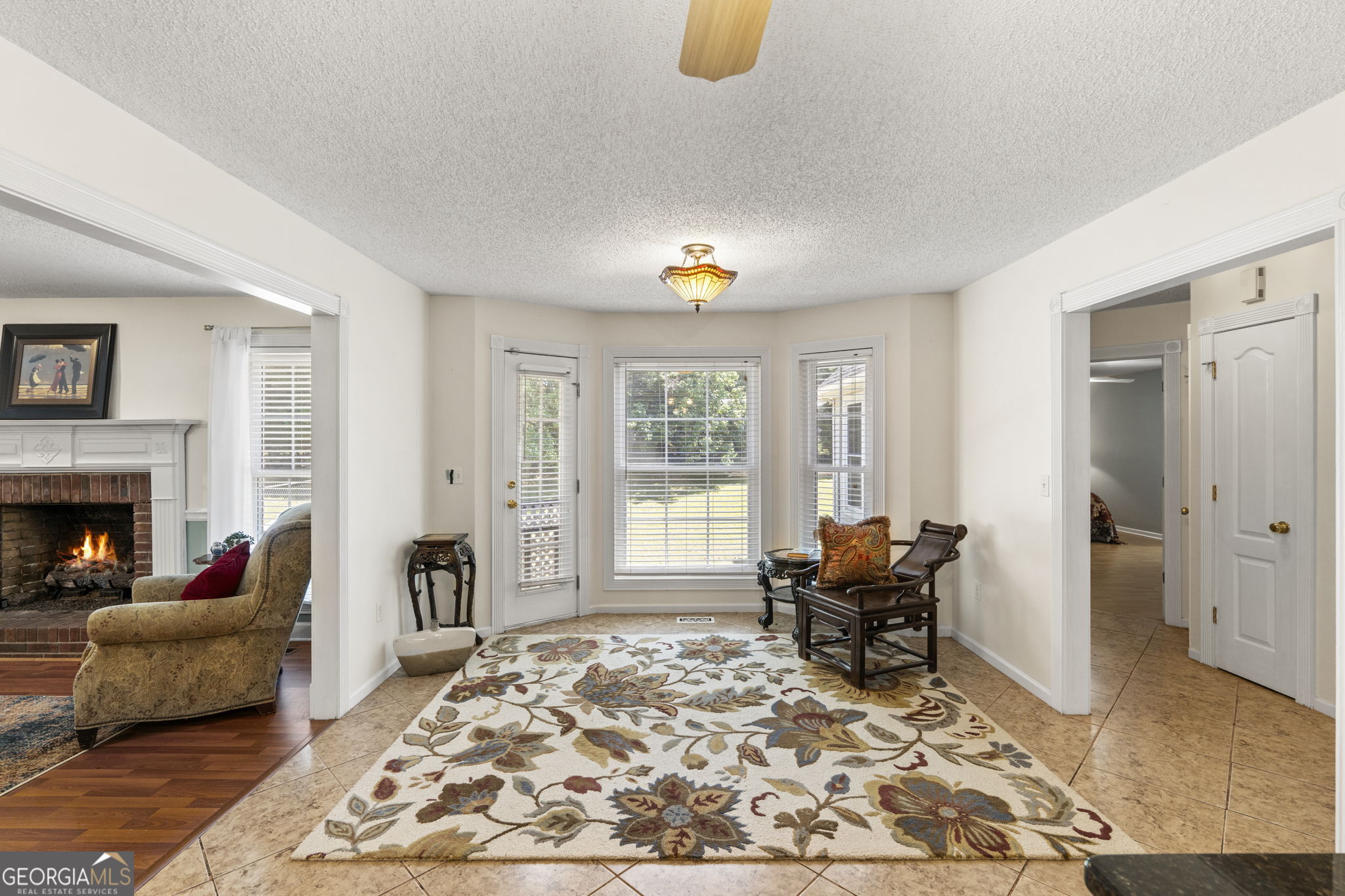 119 Moll Drive Cochran, GA 31014 - Photo 13 of 66 a living room with furniture and a fireplace