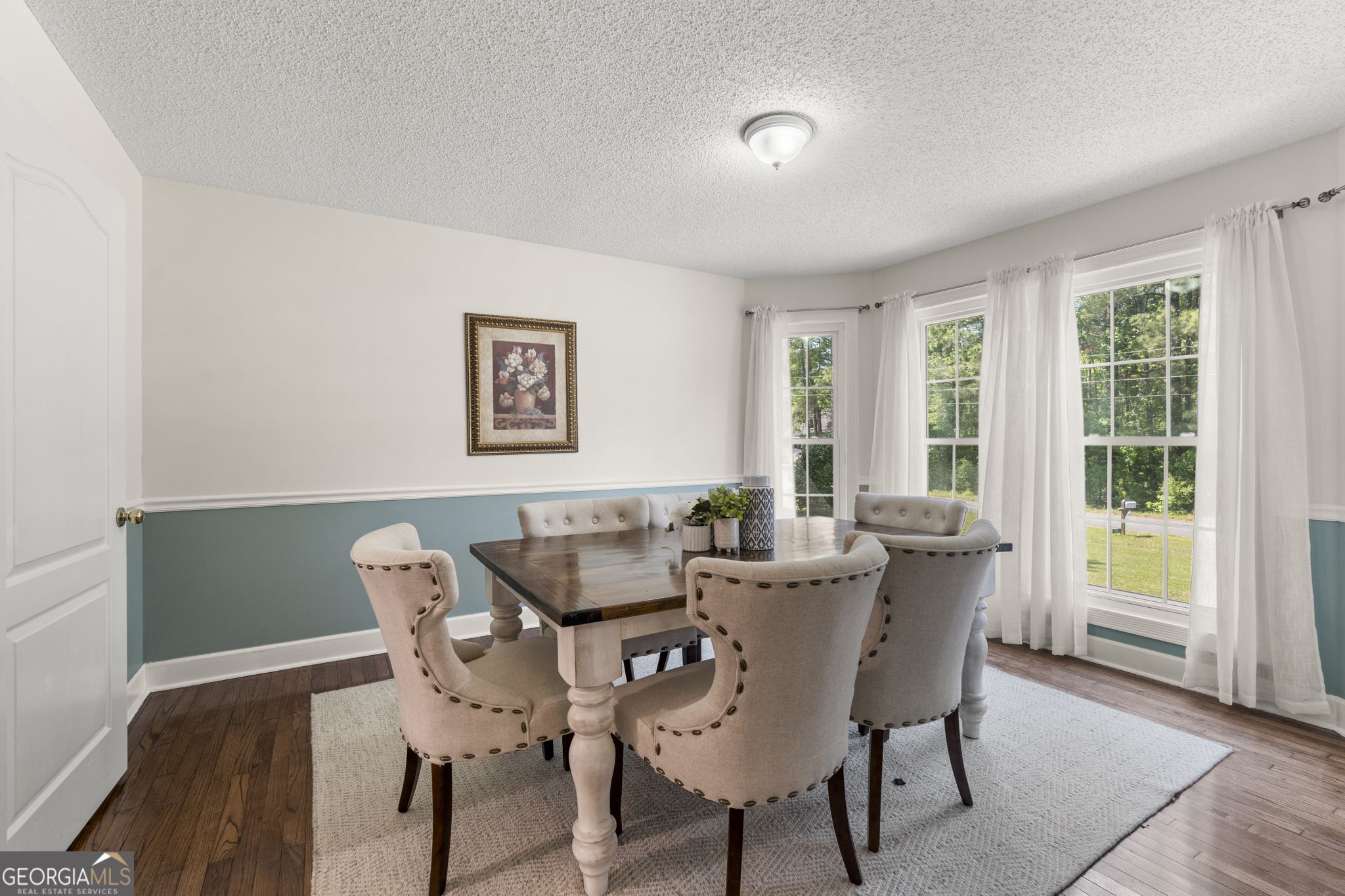 119 Moll Drive Cochran, GA 31014 - Photo 15 of 66 a view of a dining room with furniture and windows
