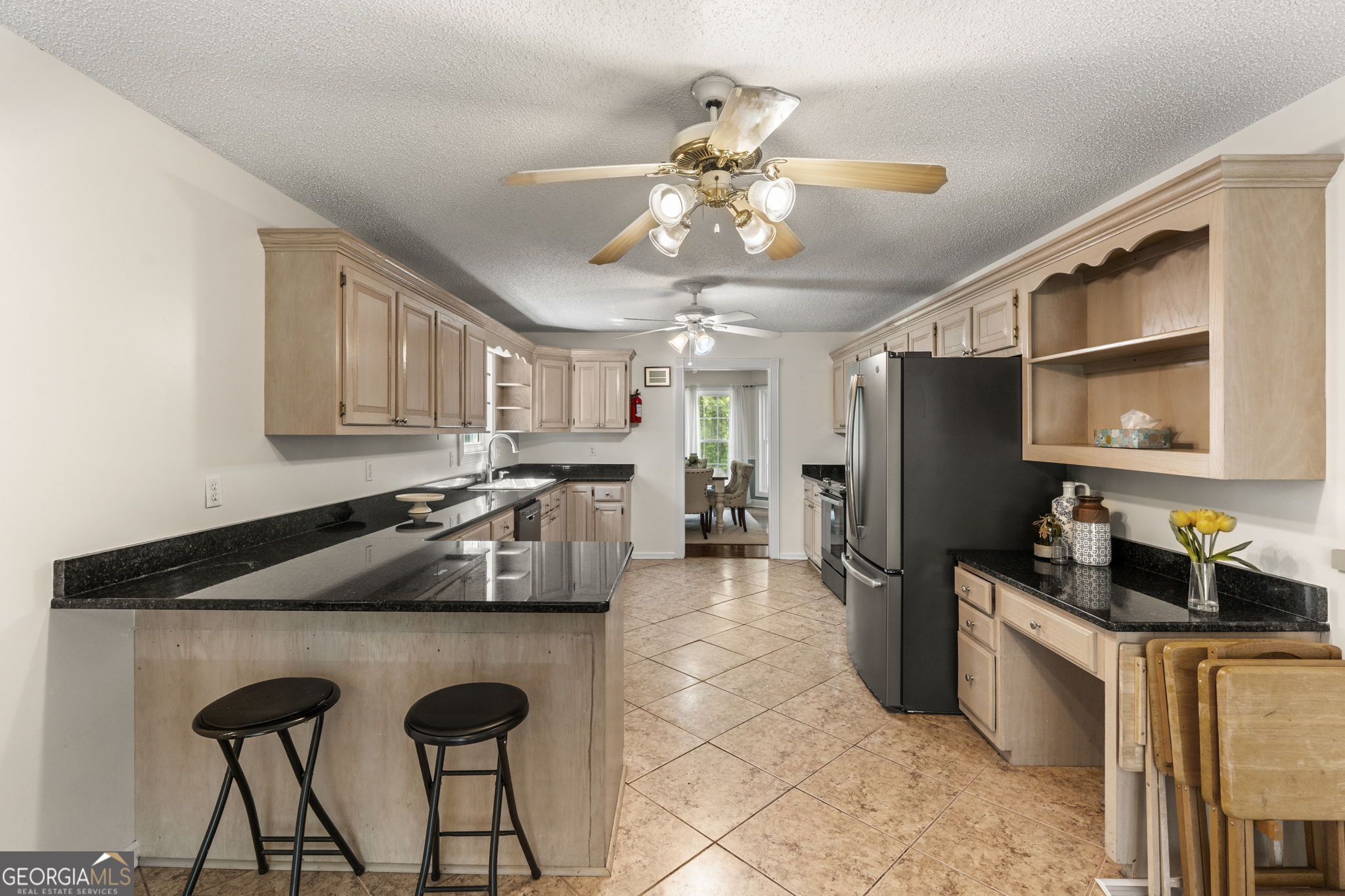 119 Moll Drive Cochran, GA 31014 - Photo 19 of 66 a kitchen with granite countertop a sink appliances and cabinets