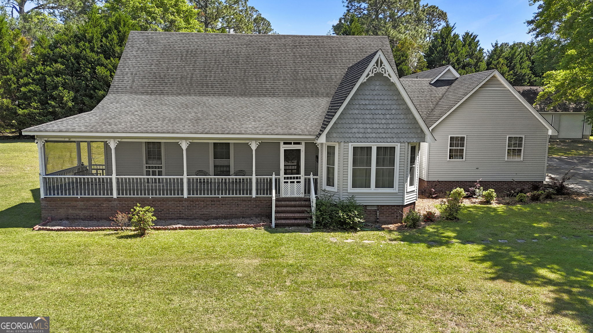 119 Moll Drive Cochran, GA 31014 - Photo 2 of 66 a front view of a house with garden