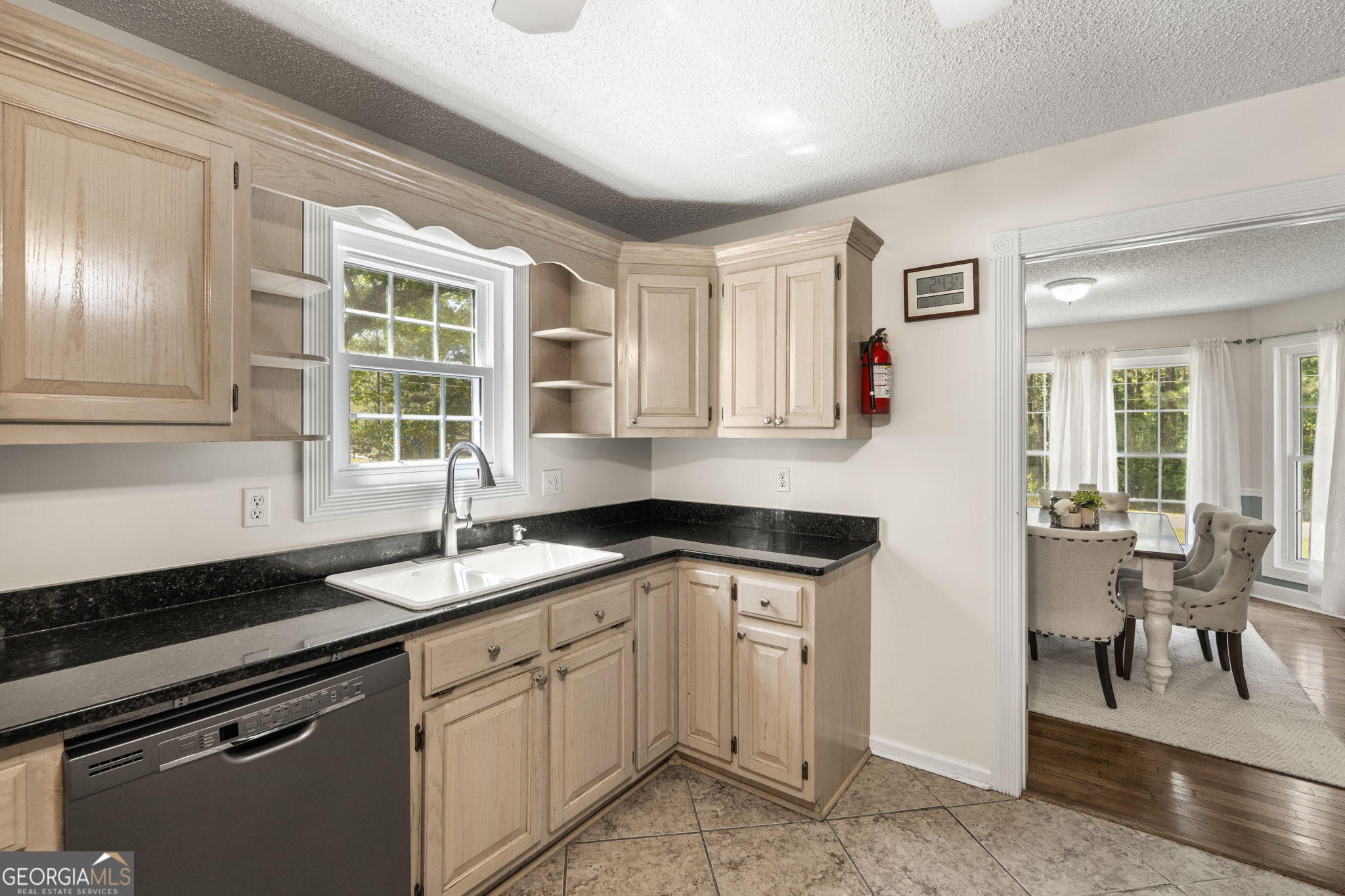 119 Moll Drive Cochran, GA 31014 - Photo 22 of 66 a kitchen with granite countertop a sink and cabinets