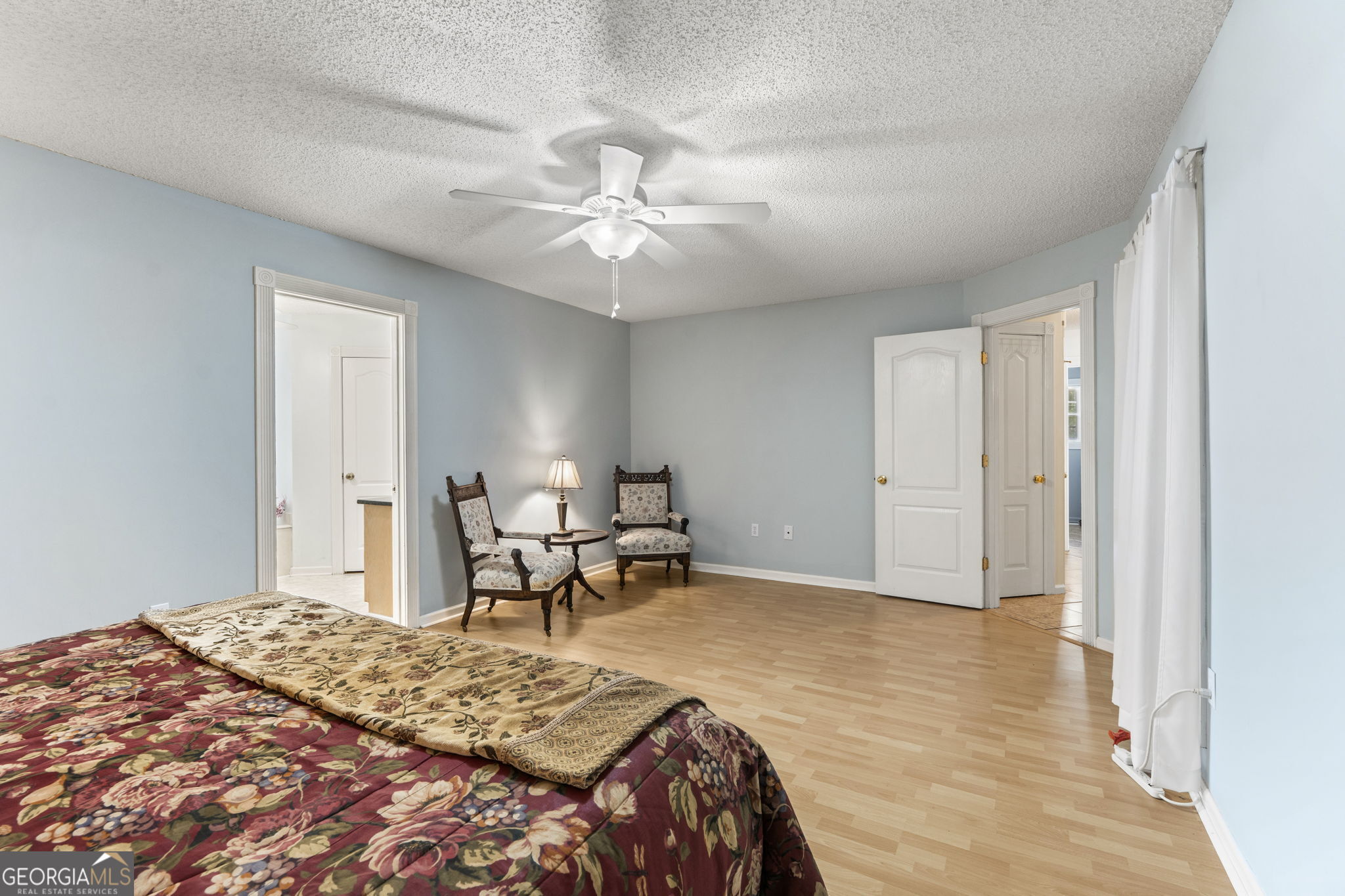 119 Moll Drive Cochran, GA 31014 - Photo 31 of 66 a bedroom with a bed and a chandelier