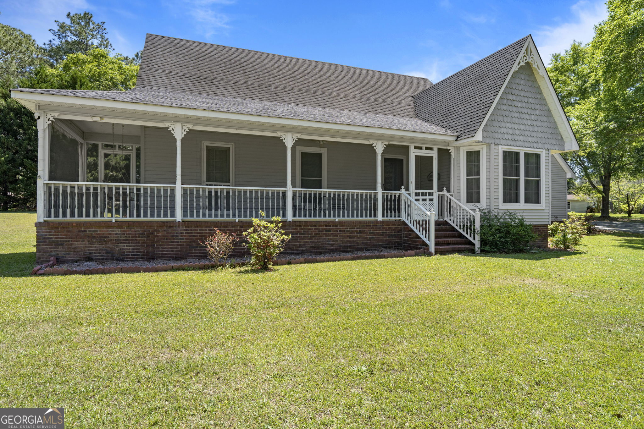 119 Moll Drive Cochran, GA 31014 - Photo 5 of 66 front view of a house with a yard