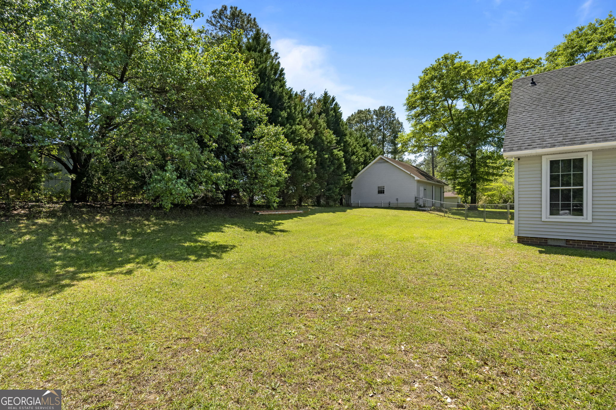 119 Moll Drive Cochran, GA 31014 - Photo 53 of 66 a swimming pool with some trees in the background