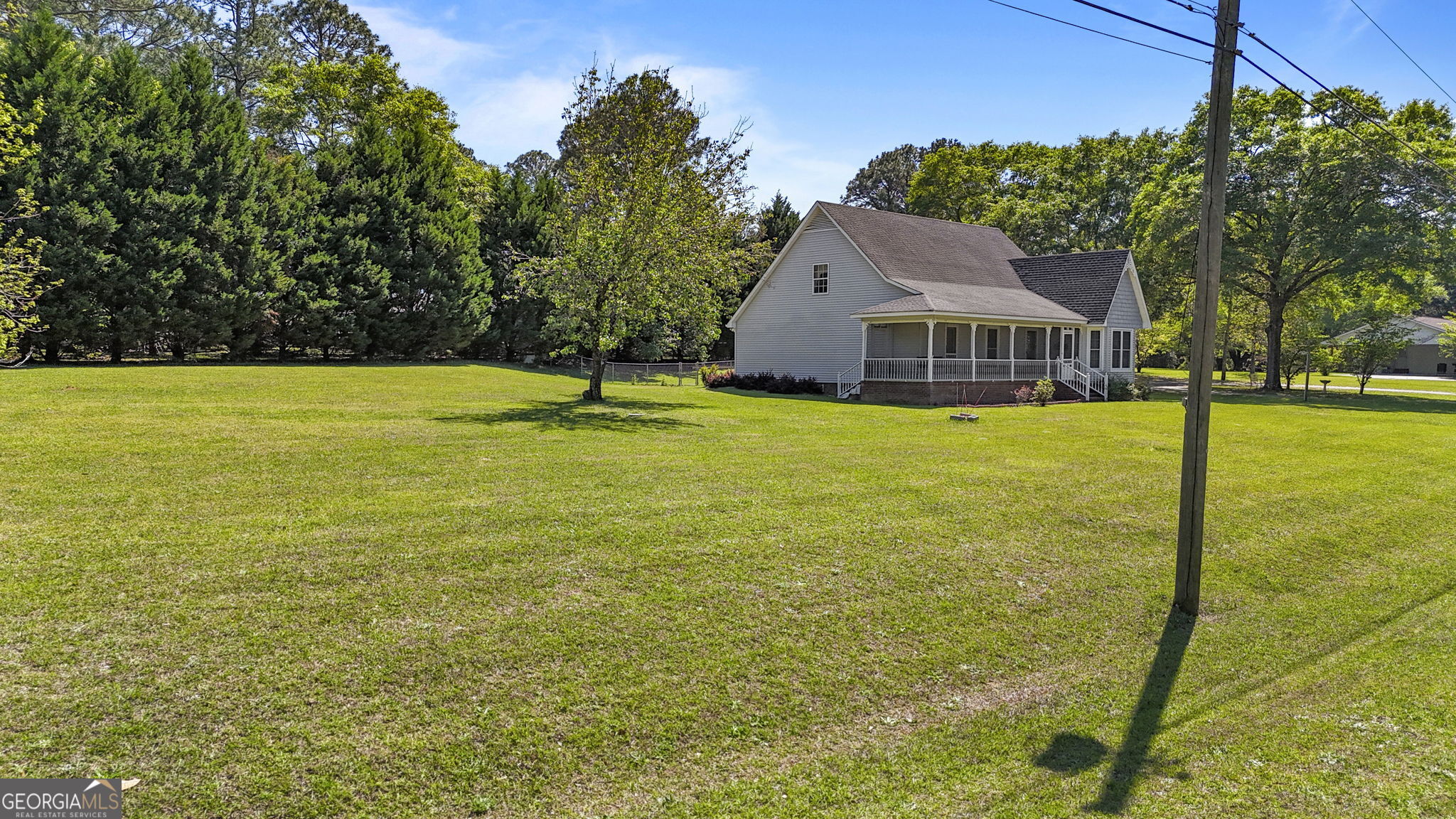 119 Moll Drive Cochran, GA 31014 - Photo 54 of 66 a front view of a house with yard