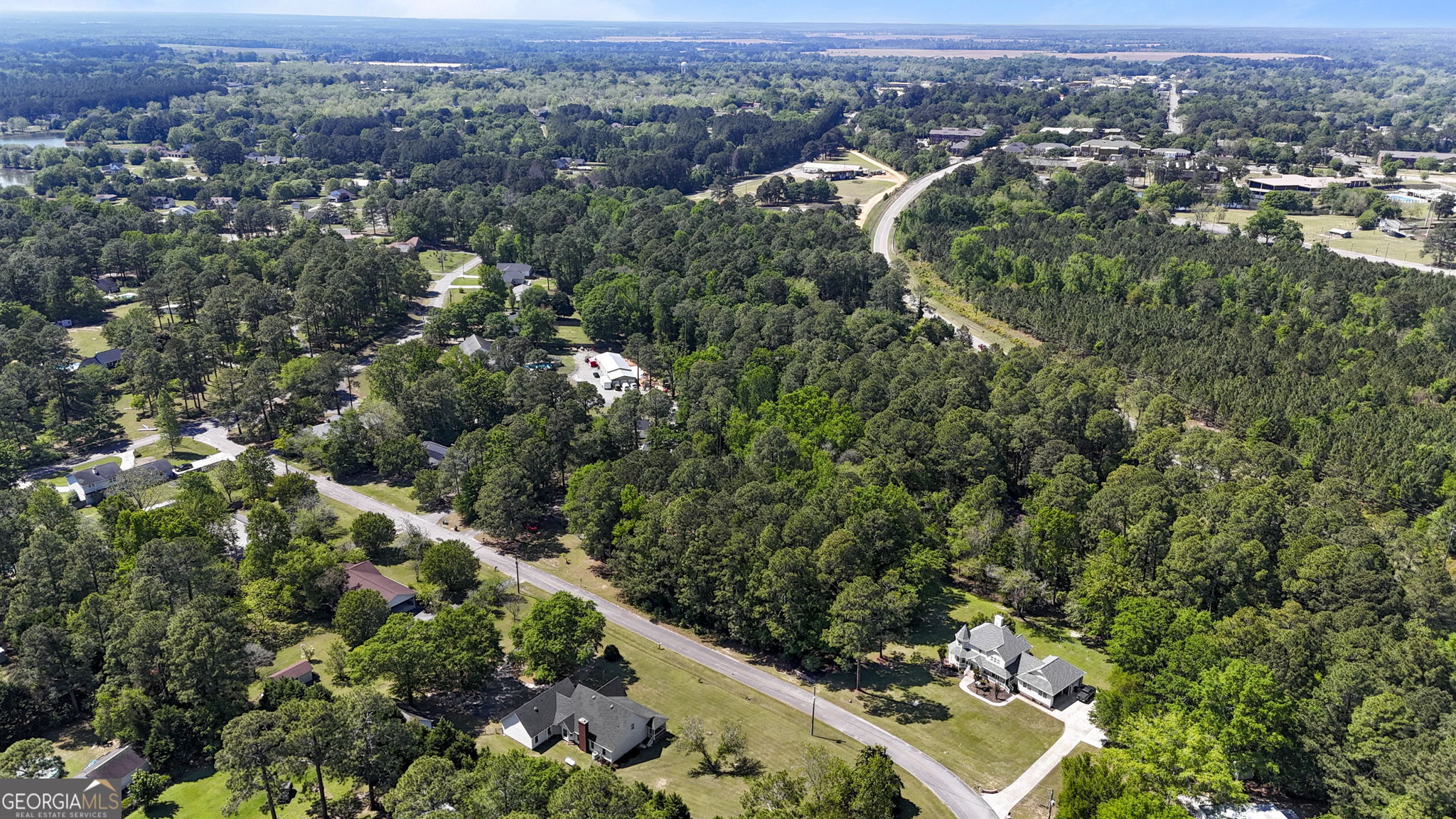 119 Moll Drive Cochran, GA 31014 - Photo 63 of 66 an aerial view of residential houses with outdoor space and trees
