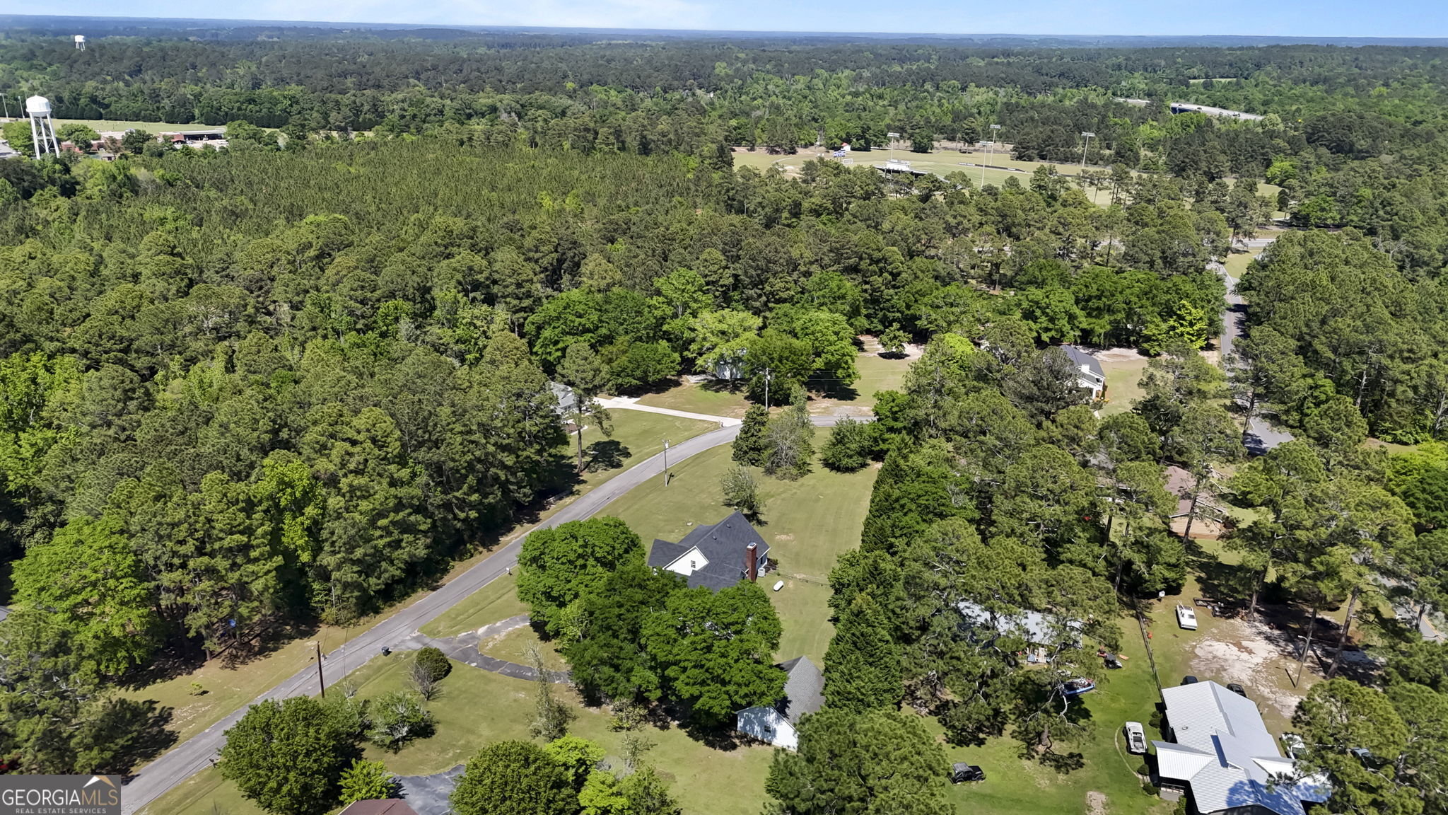 119 Moll Drive Cochran, GA 31014 - Photo 64 of 66 an aerial view of a house with yard