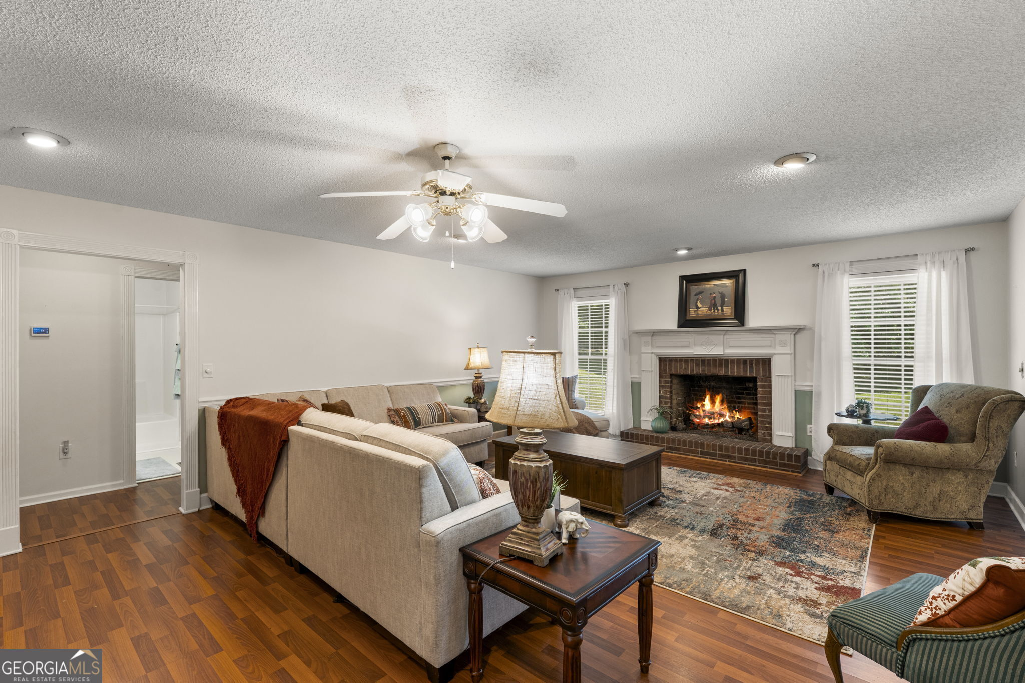 119 Moll Drive Cochran, GA 31014 - Photo 8 of 66 a living room with furniture and a fireplace