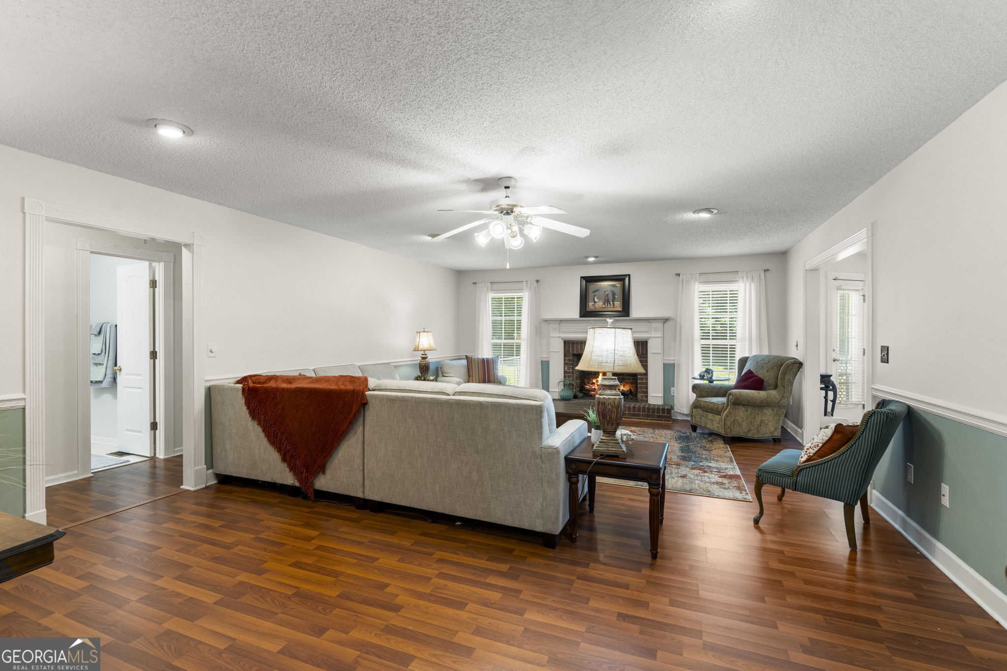 119 Moll Drive Cochran, GA 31014 - Photo 10 of 66 a living room with furniture and wooden floor