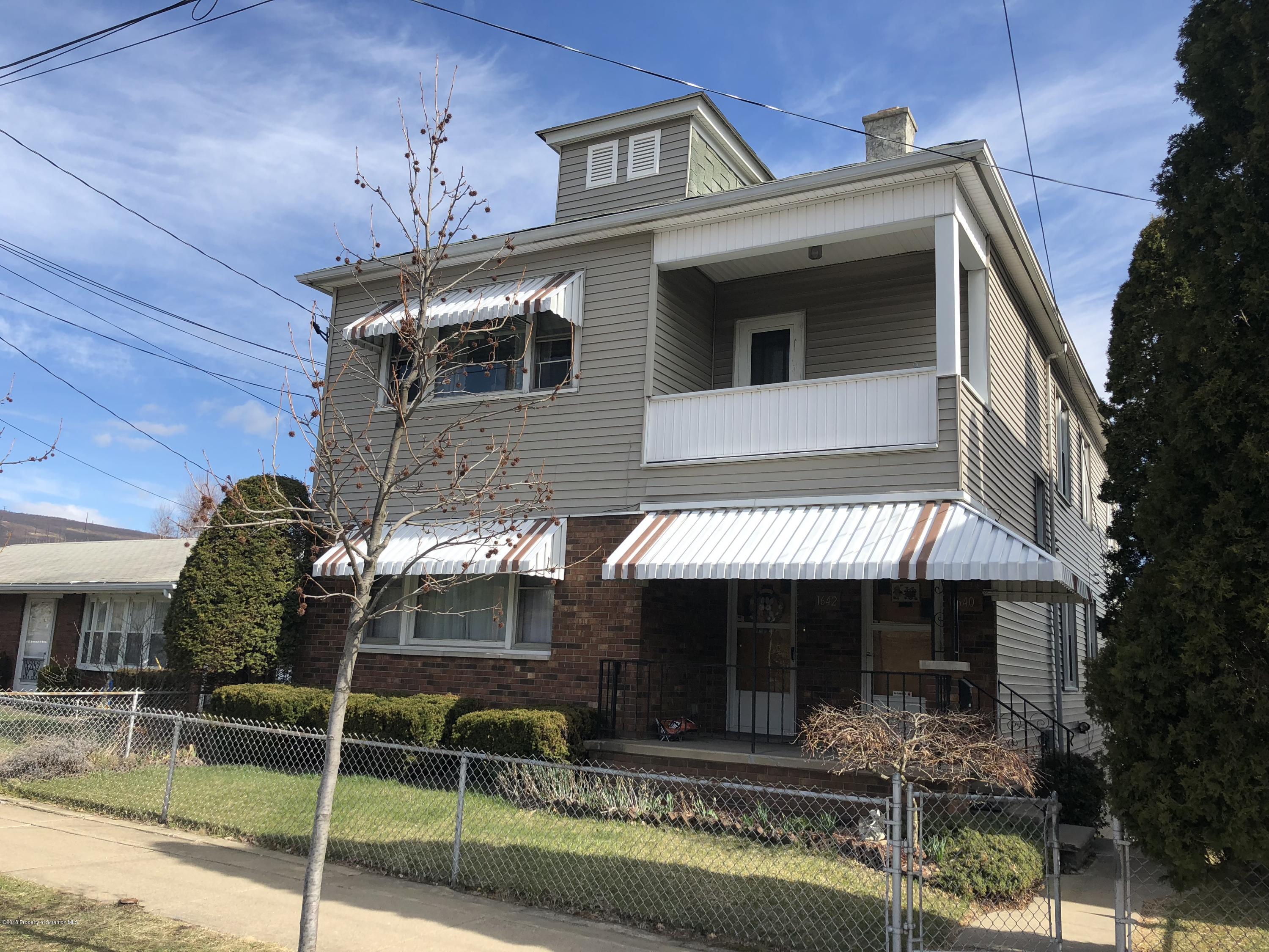 1640-1642 Farr Street Scranton, PA 18504 - Photo 1 of 12 a front view of a house with garden