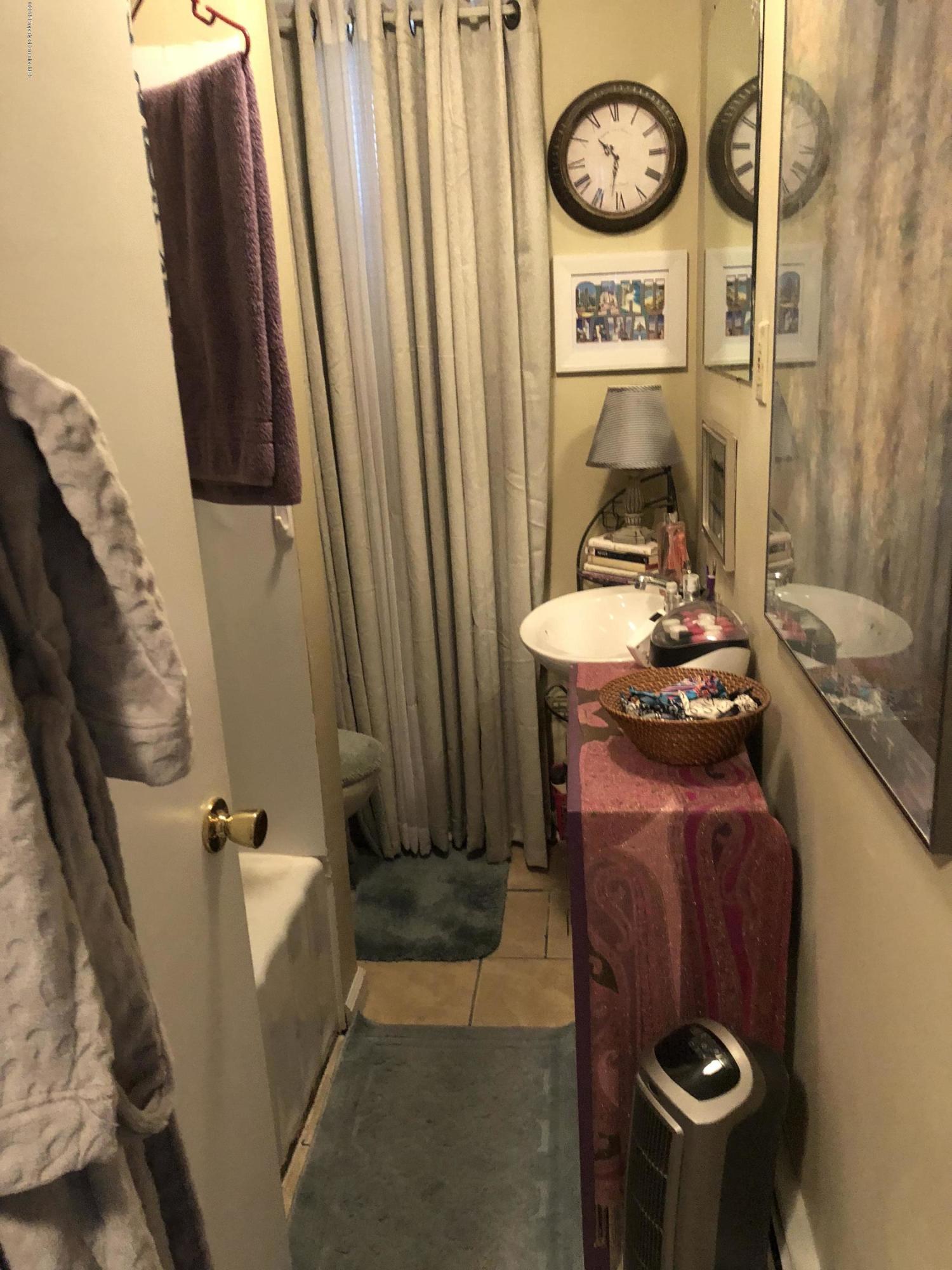 1640-1642 Farr Street Scranton, PA 18504 - Photo 11 of 12 a bathroom with a sink and a mirror