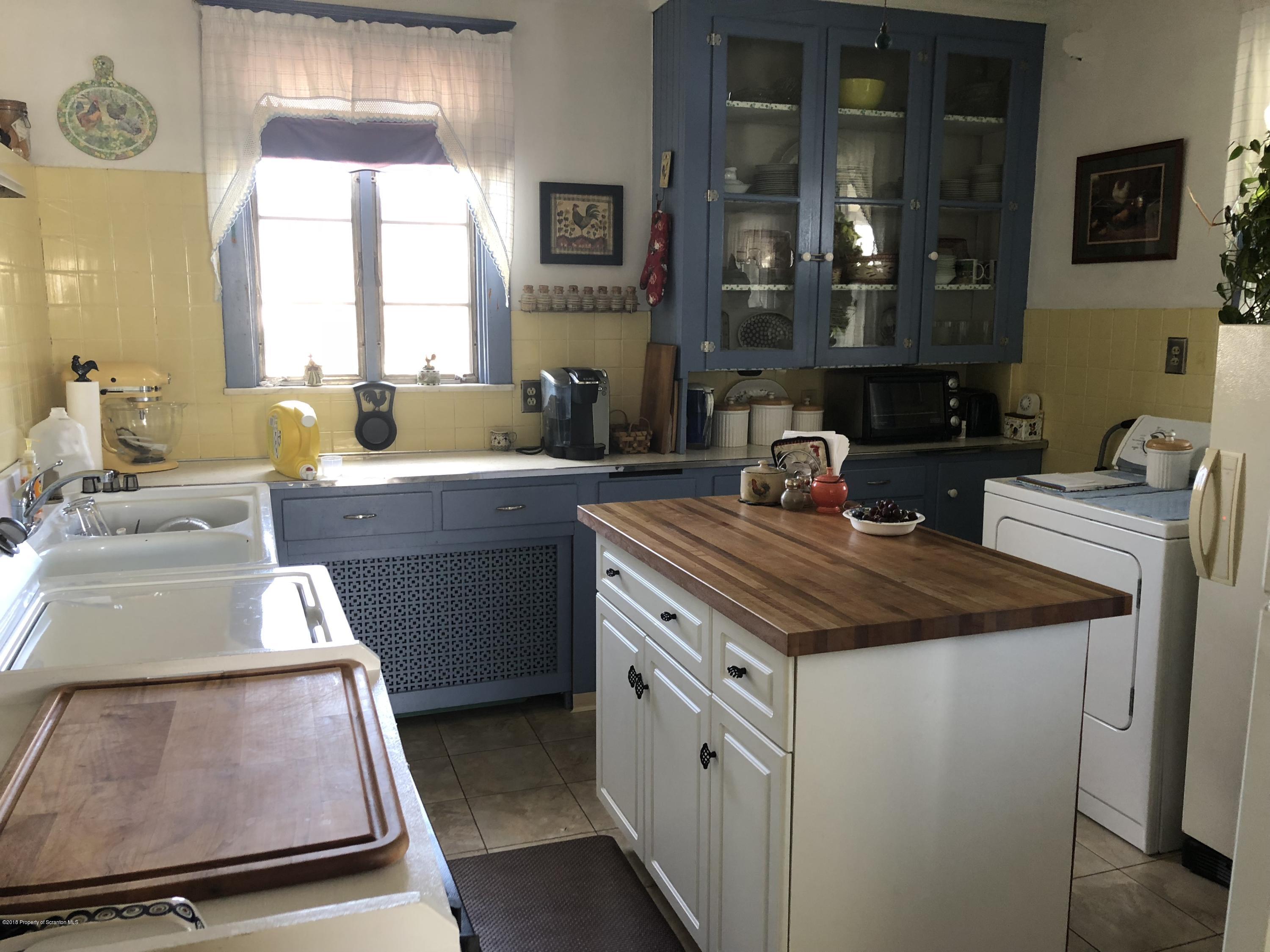 1640-1642 Farr Street Scranton, PA 18504 - Photo 2 of 12 a kitchen with a stove and a sink