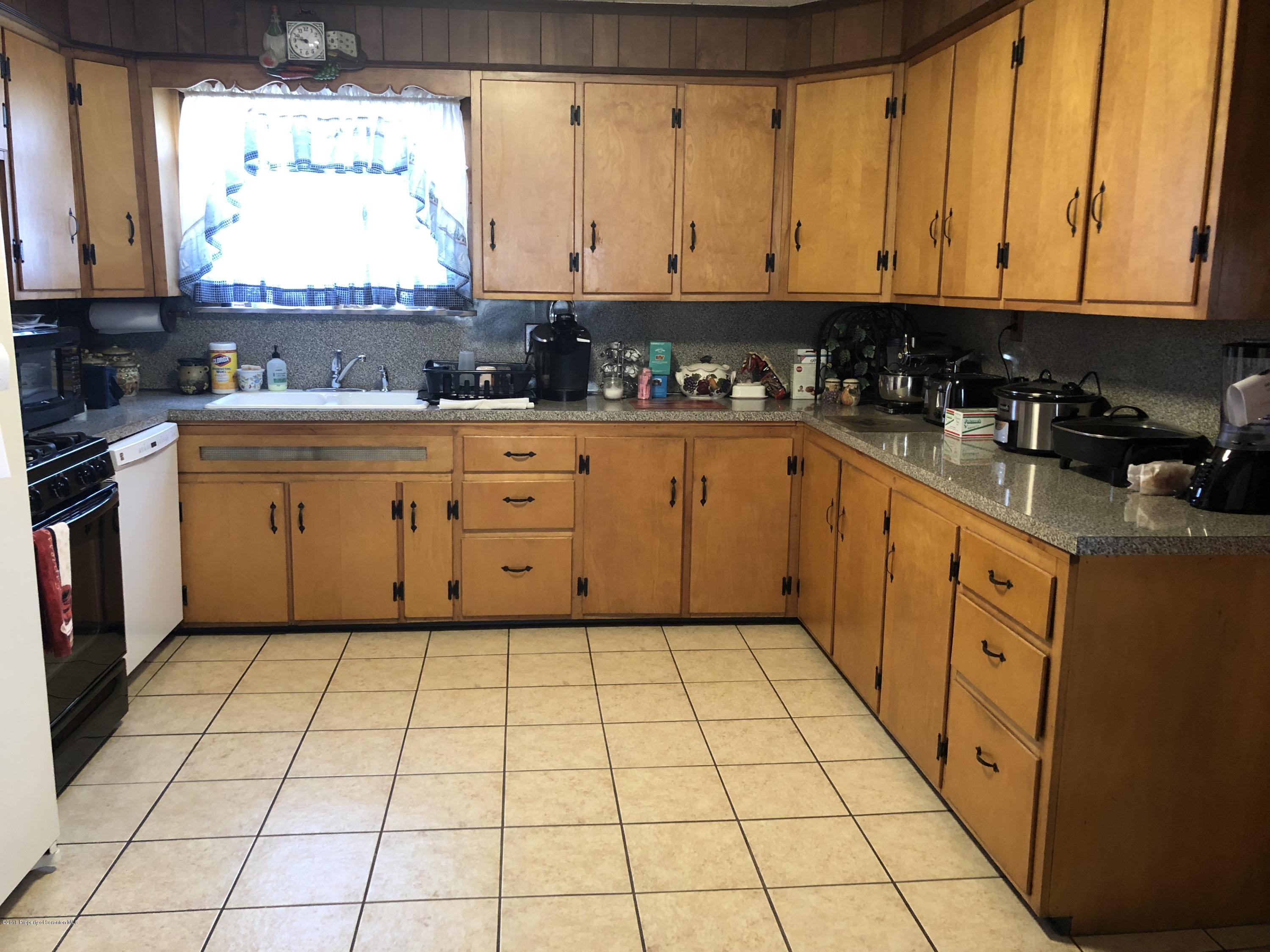 1640-1642 Farr Street Scranton, PA 18504 - Photo 7 of 12 a kitchen with stainless steel appliances a sink window and cabinets