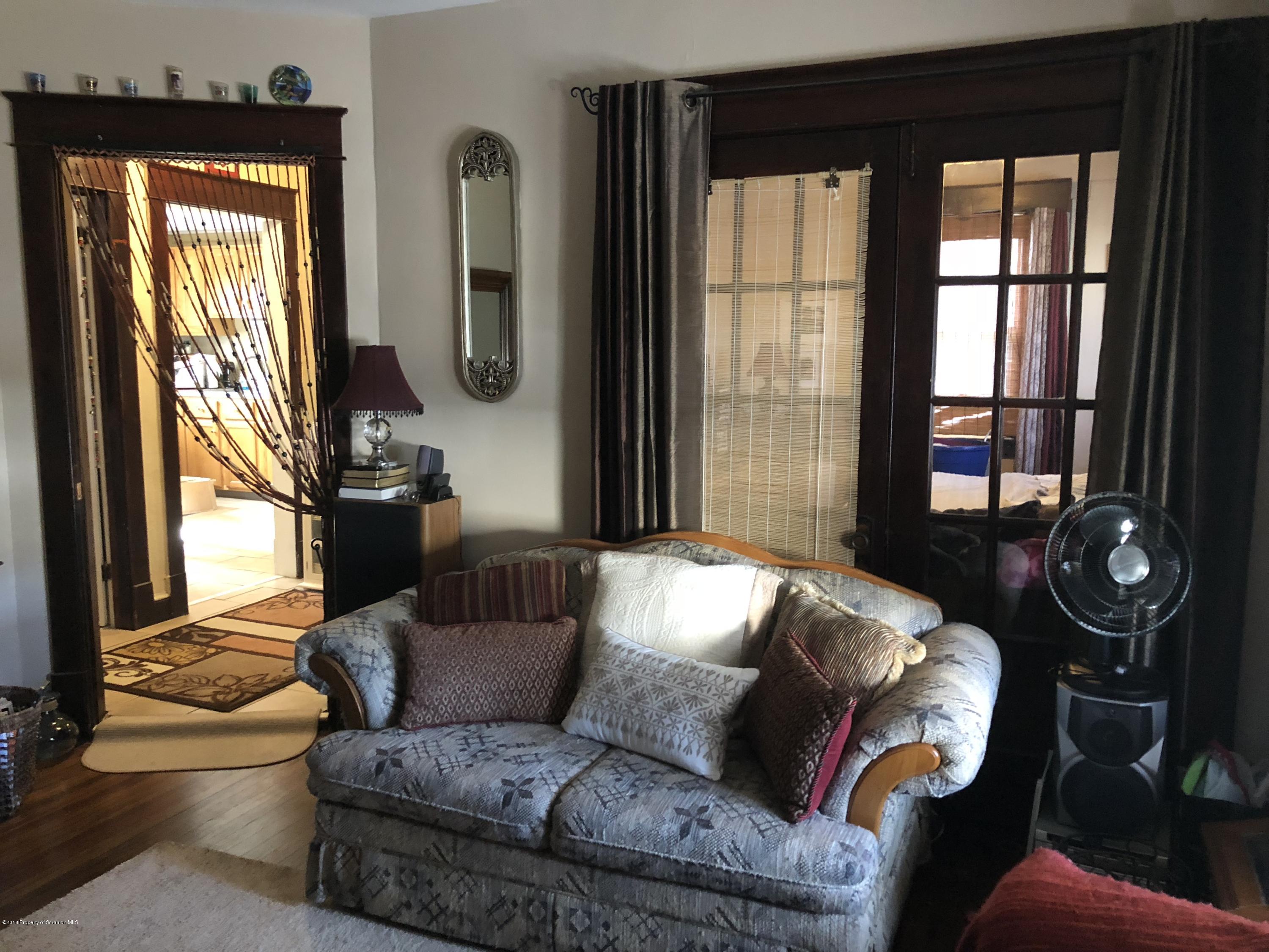 1640-1642 Farr Street Scranton, PA 18504 - Photo 10 of 12 a living room with furniture and a large window