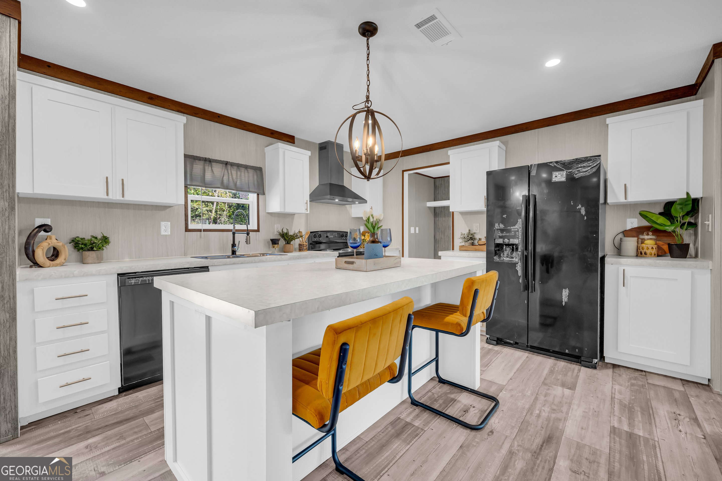 31 Dons Court Royston, GA 30662 - Photo 19 of 51 a kitchen with stainless steel appliances granite countertop a refrigerator a sink dishwasher a stove and white cabinets with wooden floor