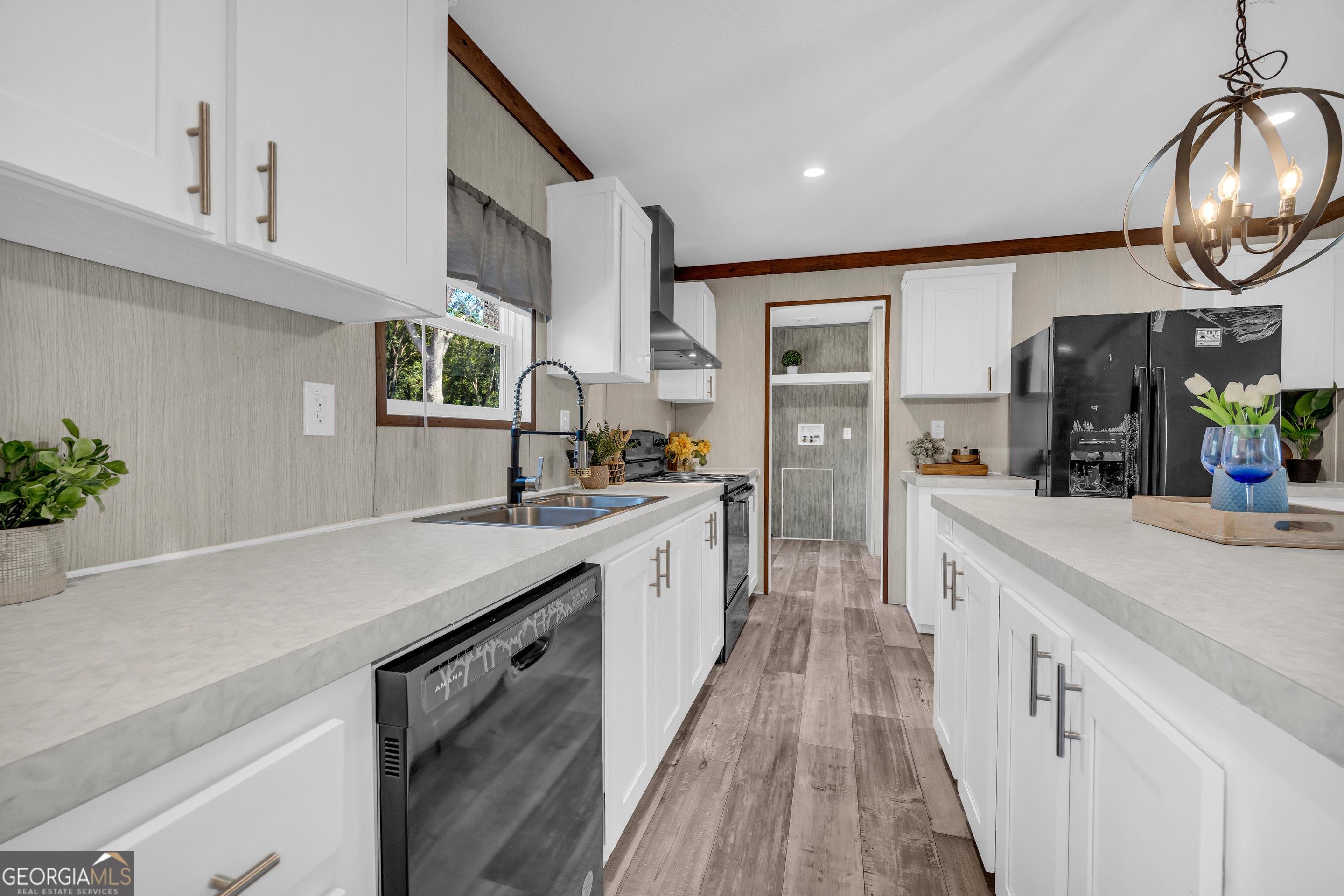 31 Dons Court Royston, GA 30662 - Photo 20 of 51 a kitchen with stainless steel appliances granite countertop a sink and dishwasher a stove with wooden floor