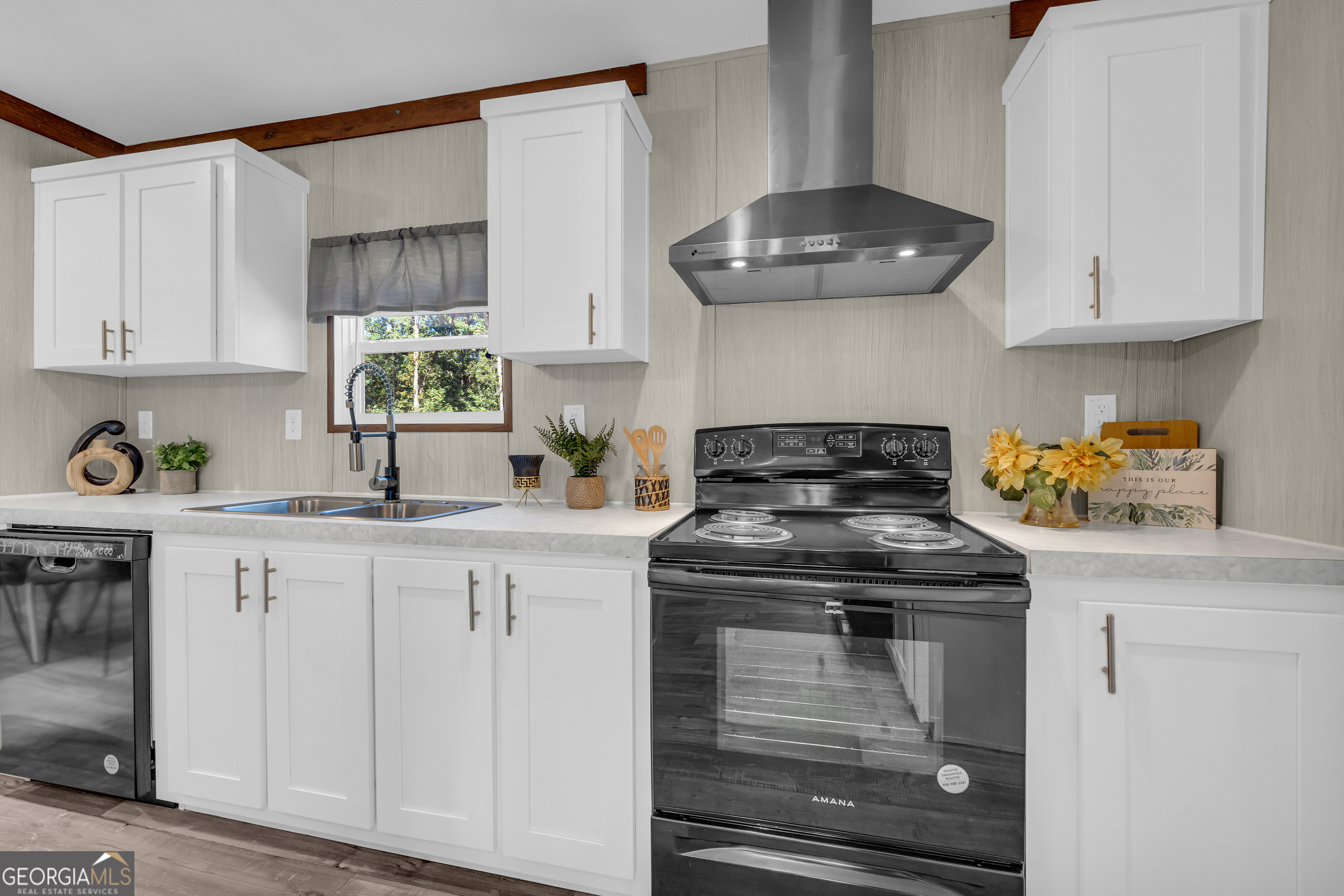 31 Dons Court Royston, GA 30662 - Photo 22 of 51 a kitchen with granite countertop white cabinets stainless steel appliances and a counter space
