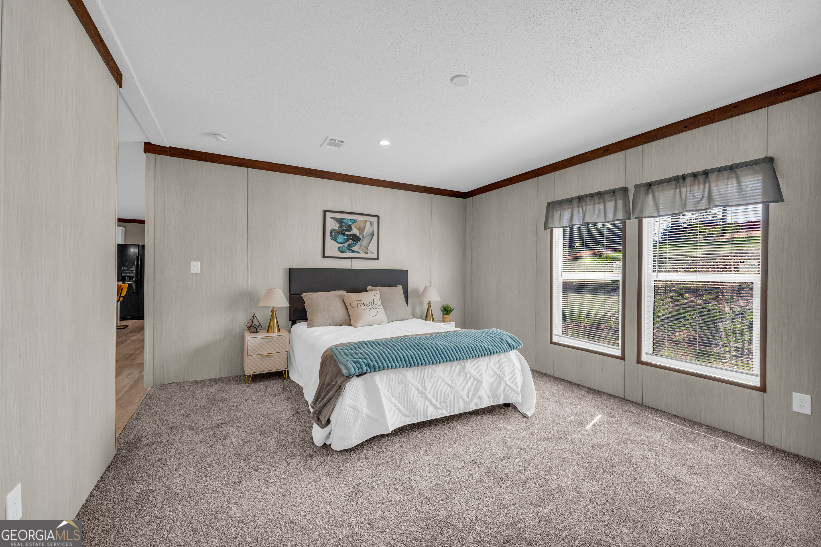 31 Dons Court Royston, GA 30662 - Photo 33 of 51 a spacious bedroom with a large bed and a large window