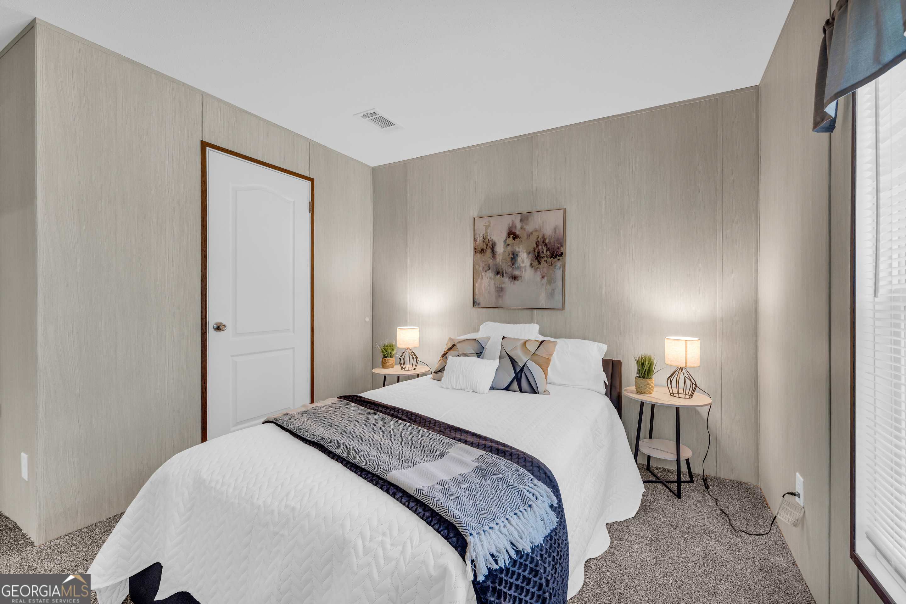 31 Dons Court Royston, GA 30662 - Photo 37 of 51 a bedroom with a bed and a painting on the wall