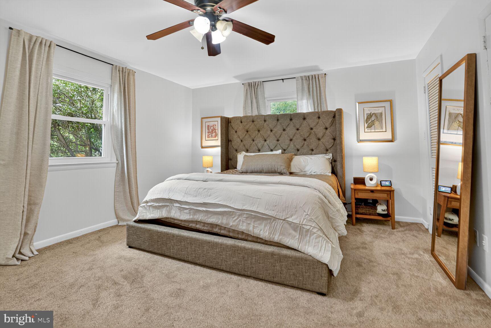 4004 David Lane Alexandria, VA 22311 - Photo 13 of 25 a spacious bedroom with a bed and a chandelier