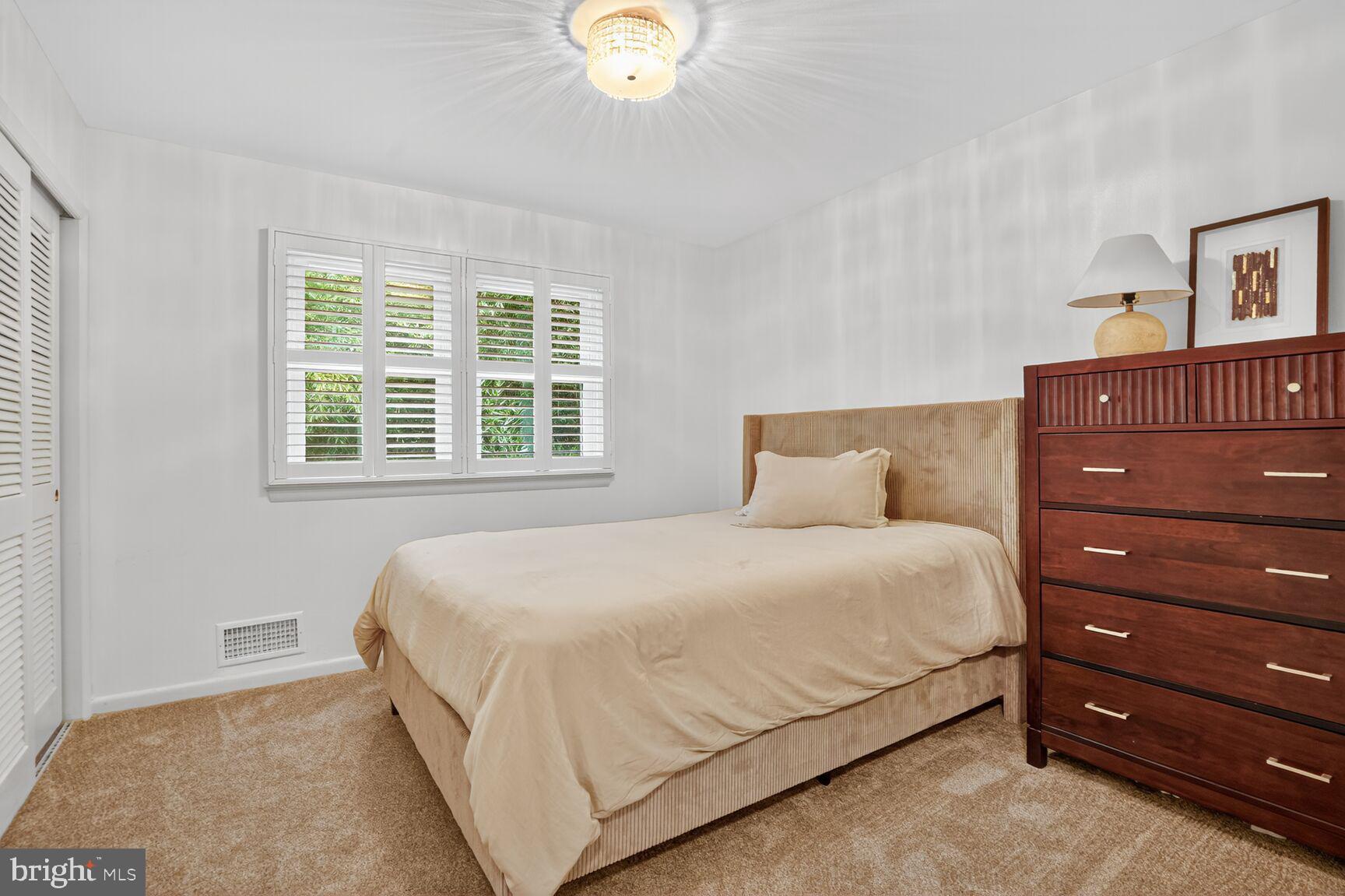 4004 David Lane Alexandria, VA 22311 - Photo 16 of 25 a bedroom with a bed and a window