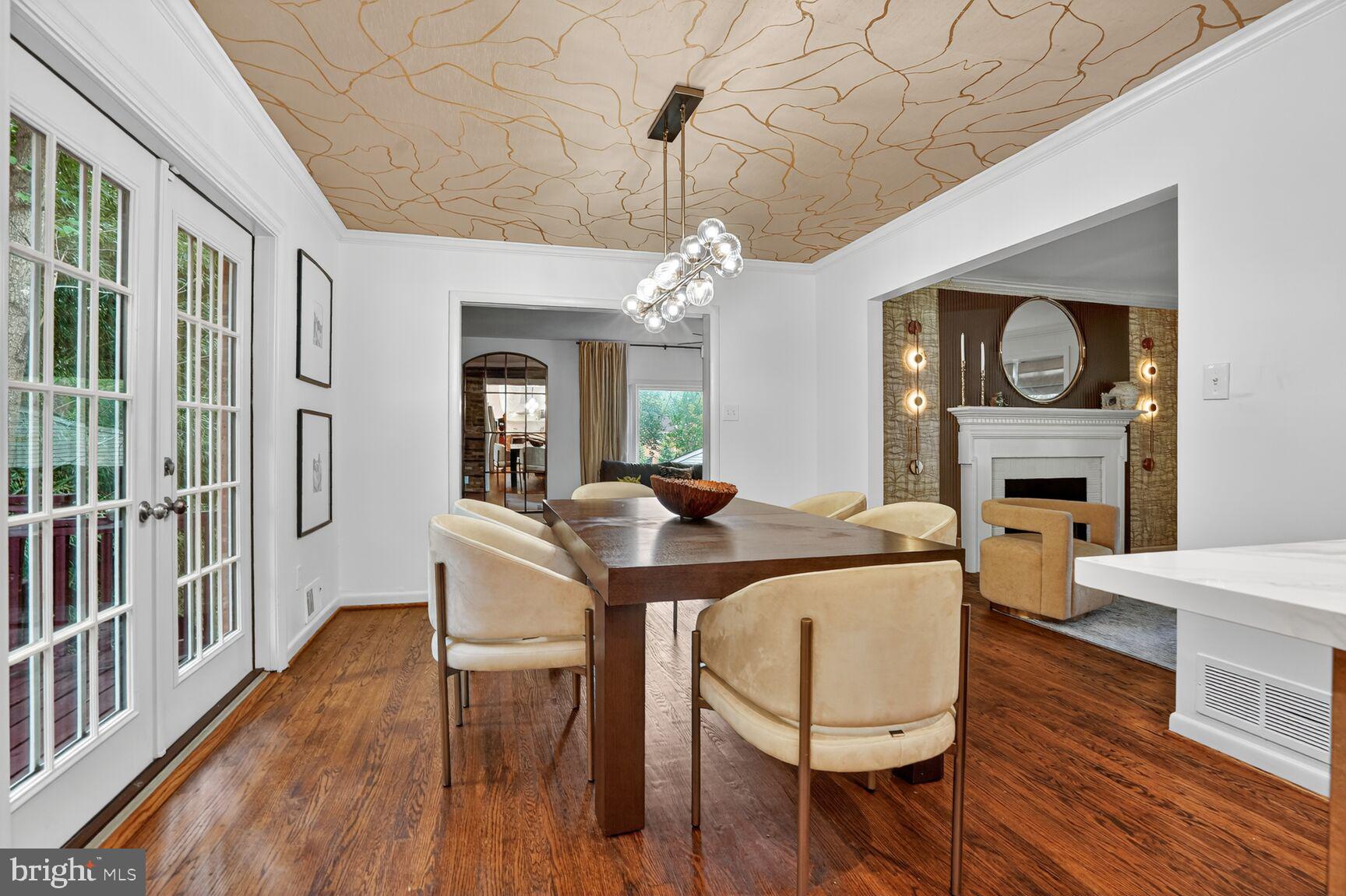 4004 David Lane Alexandria, VA 22311 - Photo 5 of 25 a living room with furniture a fireplace and a table
