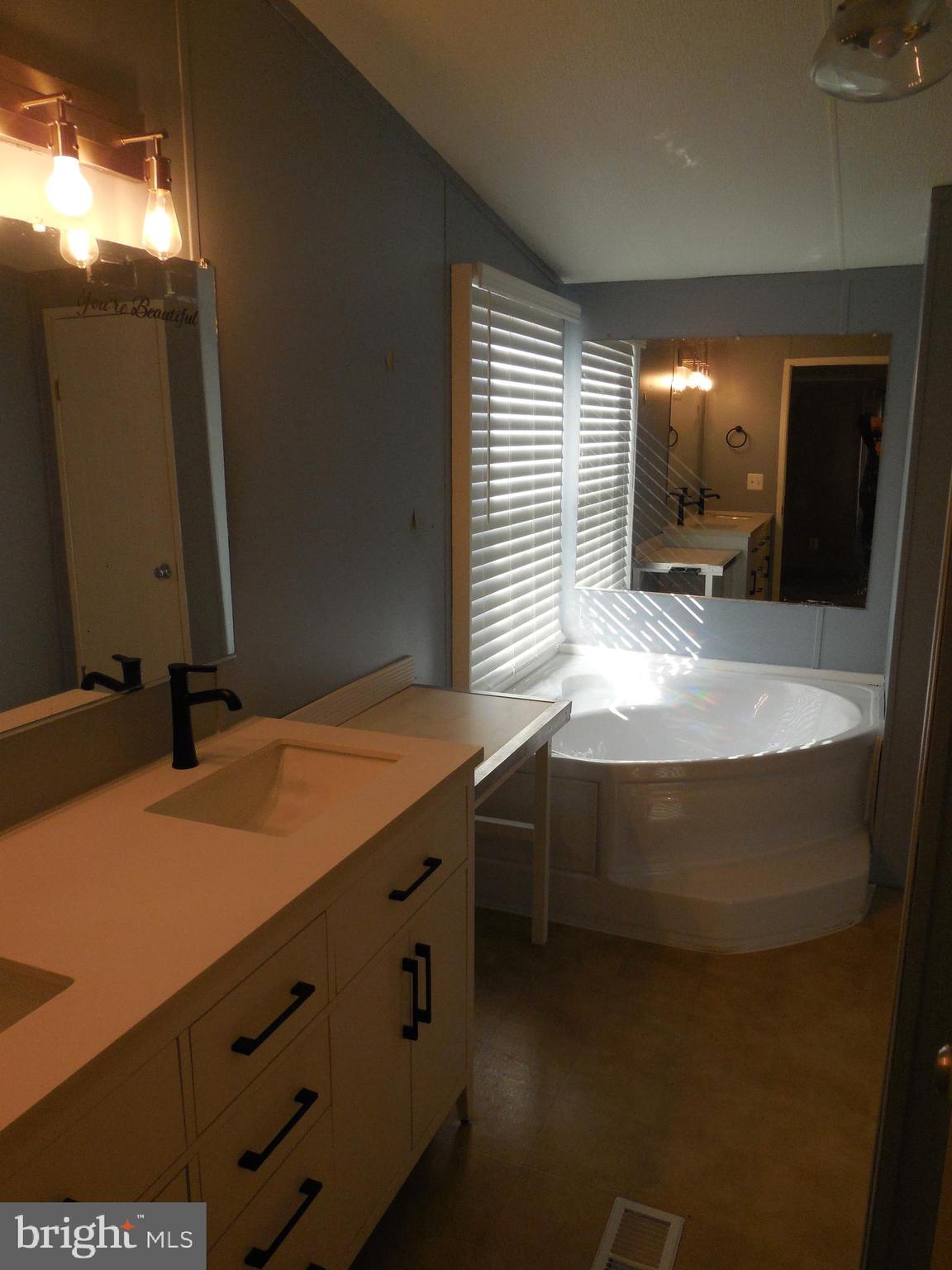 4041 Conowingo Road, Unit 14 Darlington, MD 21034 - Photo 21 of 27 a bathroom with a sink and a mirror