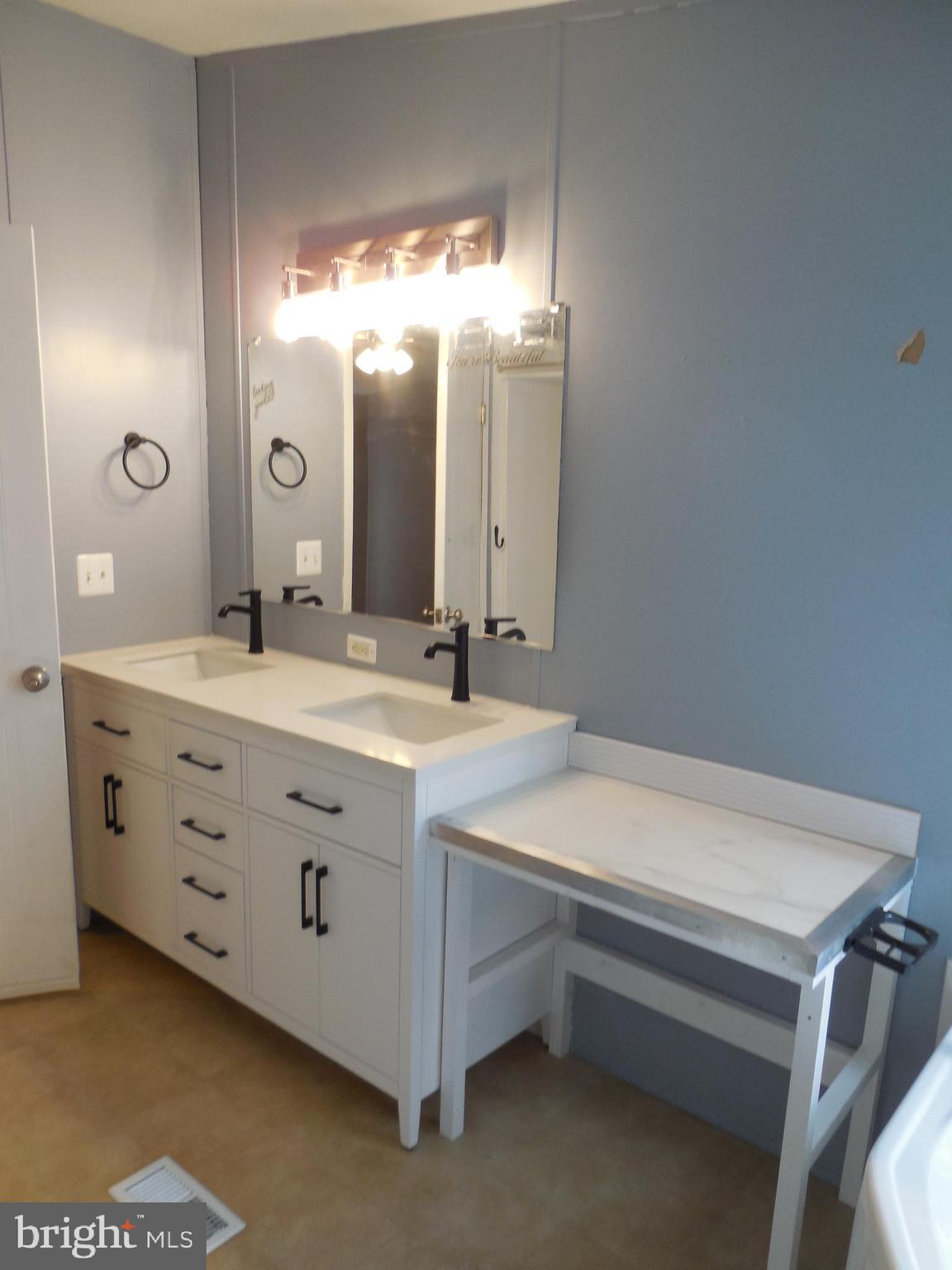 4041 Conowingo Road, Unit 14 Darlington, MD 21034 - Photo 22 of 27 a bathroom with a double vanity sink mirror and